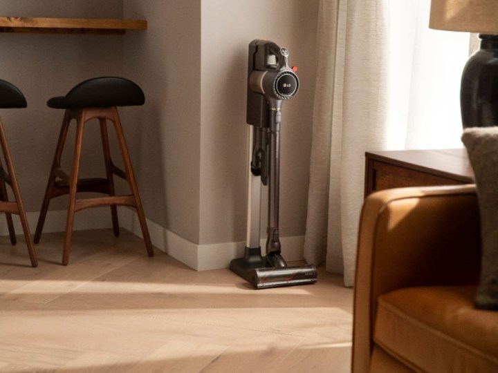 LG CordZero cordless stick vacuum charging in a vertical charging stand..