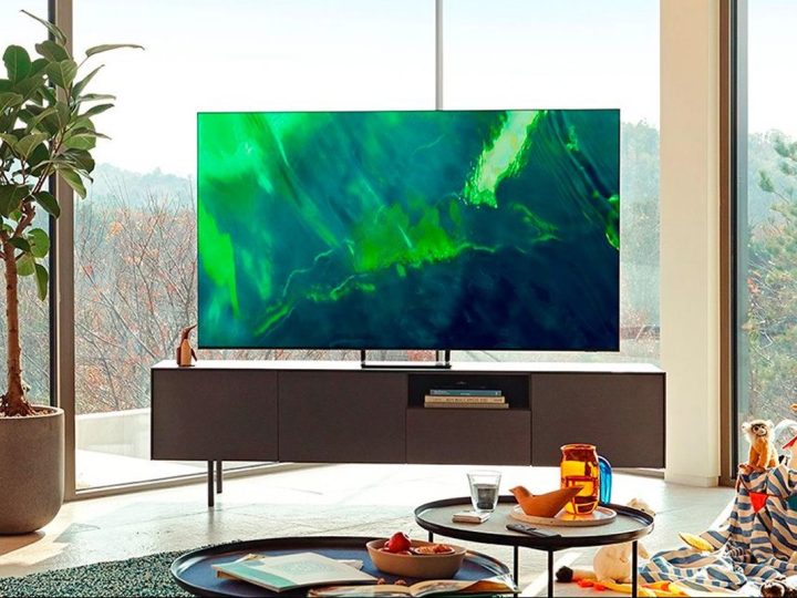 A Samsung 65-inch QLED 4K smart TV sets in a living room.