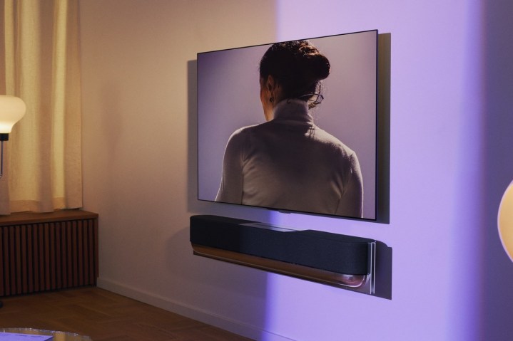 Bang & Olufsen Beosound Theatre seen wall-mounted below a TV.