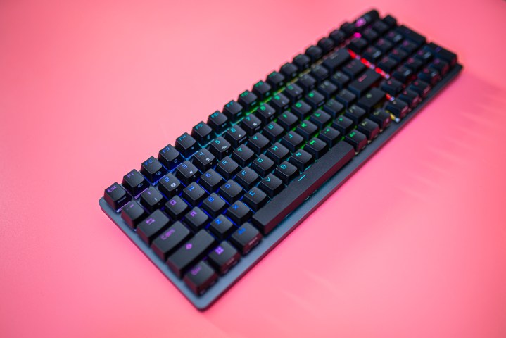 Asus ROG Strix Scope II 96 on a pink background.