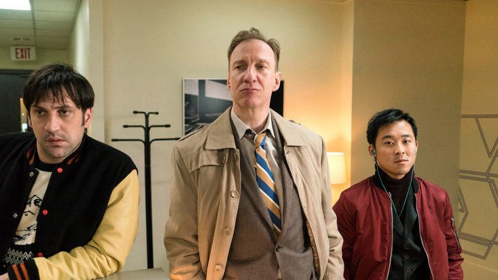 Three men stand together in a scene from Fargo.