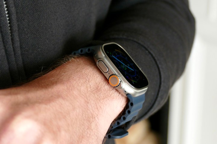 The side of the Apple Watch Ultra on a man's wrist.