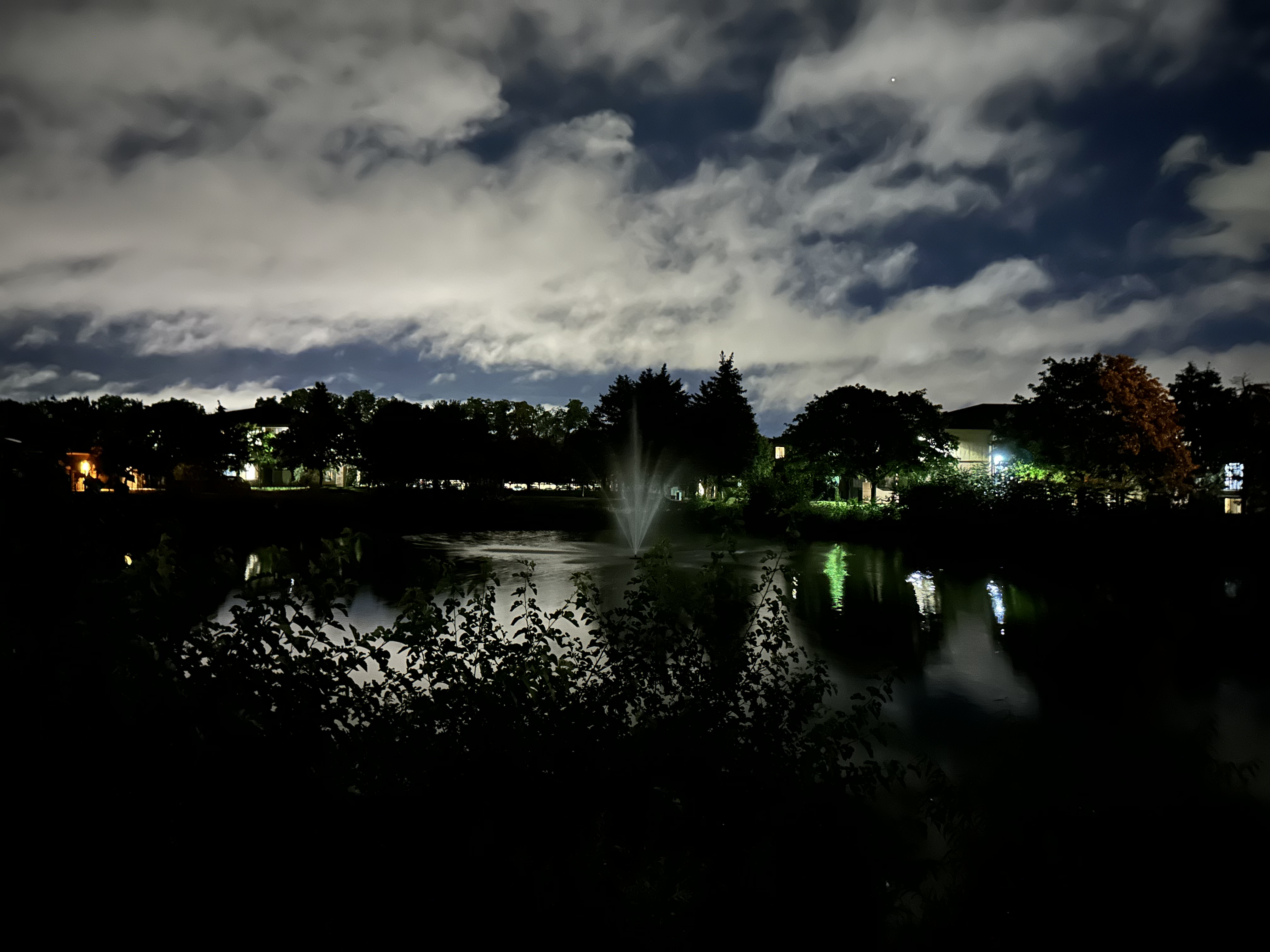 Photo of a pond at night, taken with the iPhone 14 Pro.