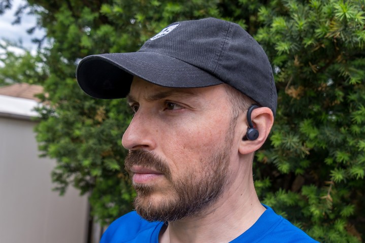 Wearing the Anker Soundcore Sport X10 earbuds.
