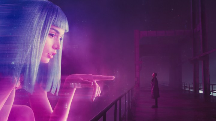 A giant hologram of Joi reaching out to K in Blade Runner 2049.