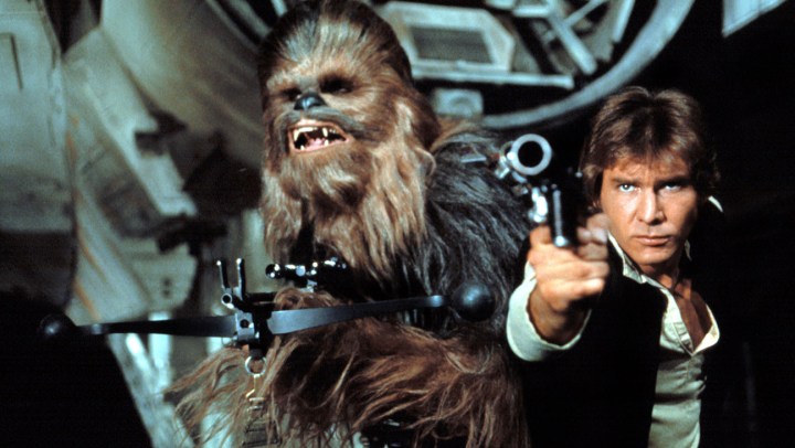Chewbacca and Han Solo aiming guns.