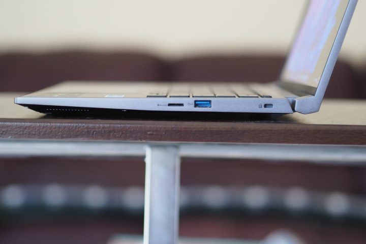 Acer Swift X 14 side view showing ports and display.