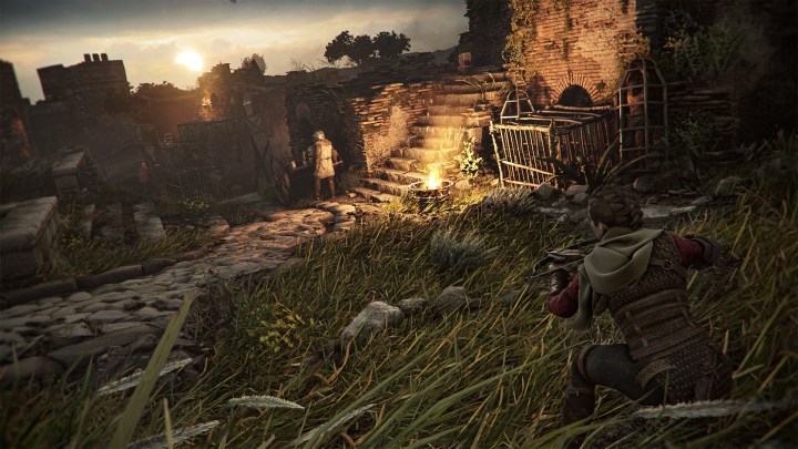 Amicia holds a crossbow in A Plague Tale: Requiem.