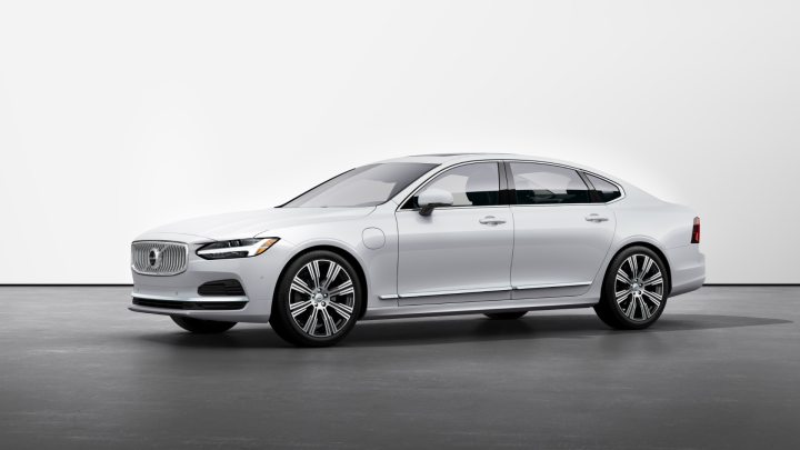 A white Volvo S90 Recharge against a white backdrop. 