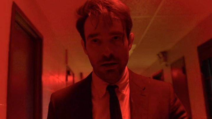 Charlie Cox as Matt Murdock under the neon red lights of the prison in season 3