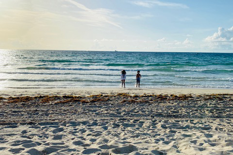 Two people at a beach.