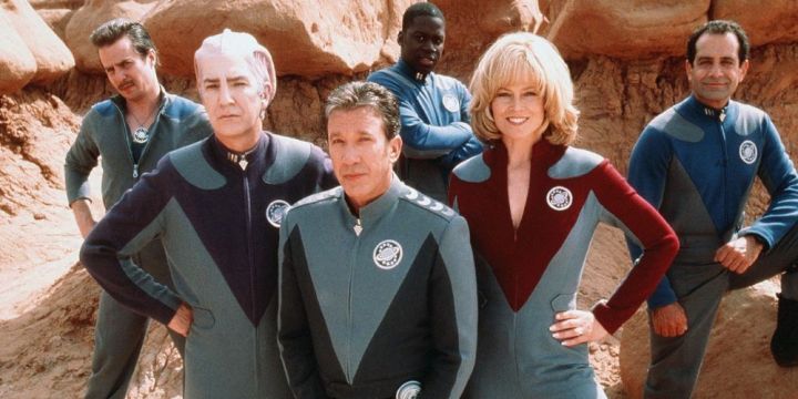 The Galaxy Quest crew stand in the desert.