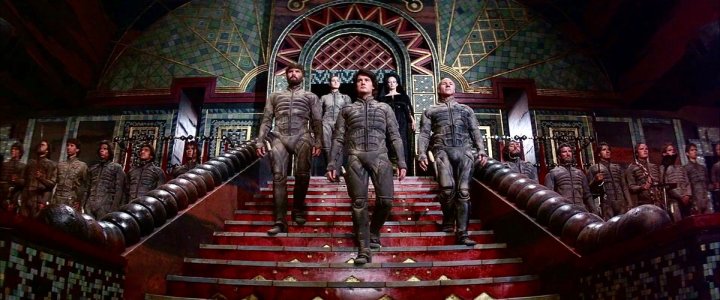 The cast of David Lynch's Dune walk down the stairs.