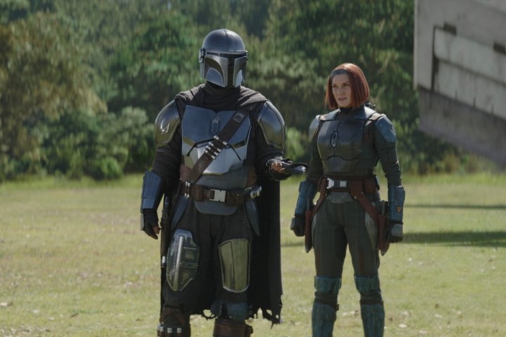 Din Djarin stands in front of Bo-Katan in The Mandalorian season 3 episode 6.