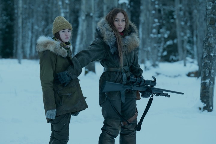 Jennifer Lopez shields a girl with a gun from The Mother.