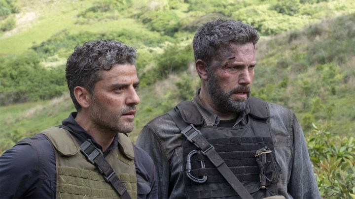 Oscar Isaac and Ben Affleck stand next to each other as soldiers in Triple Frontier.