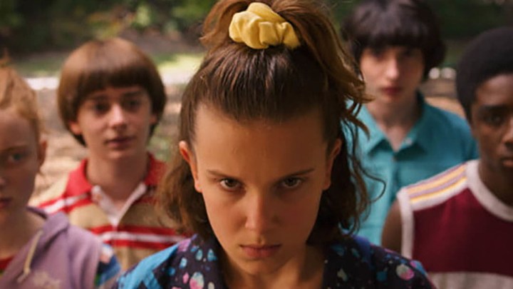 Eleven looking angry as she tries to control something with her mind on Stranger Things.