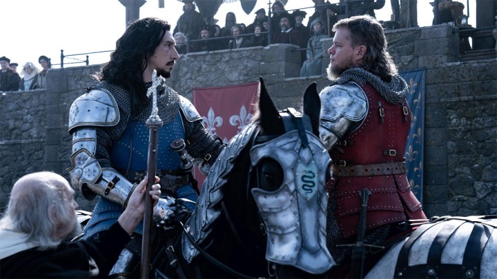 Adam Driver and Matt Damon sit on horses in The Last Duel.