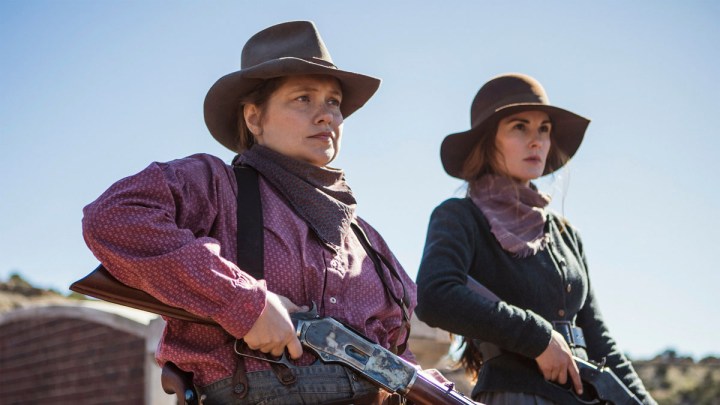 Two women hold guns in Godless.