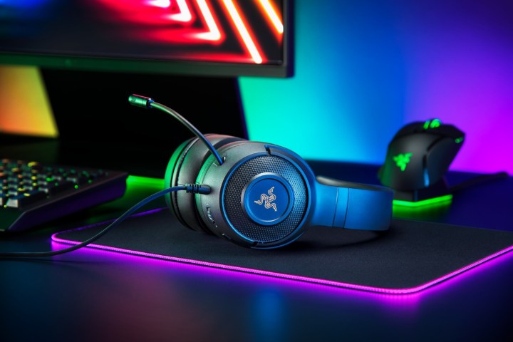 The Kraken V3 gaming headset on a black table.