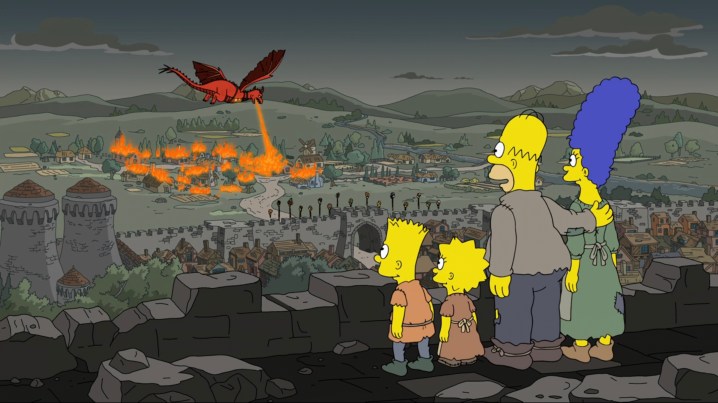 The Simpsons watching a dragon burn down Springfieldia in "The Simpsons."