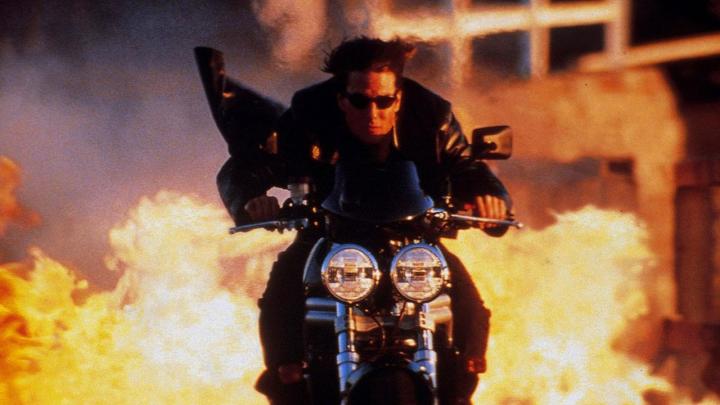 Tom Cruise riding a motorcycle in "Mission: Impossible 2."