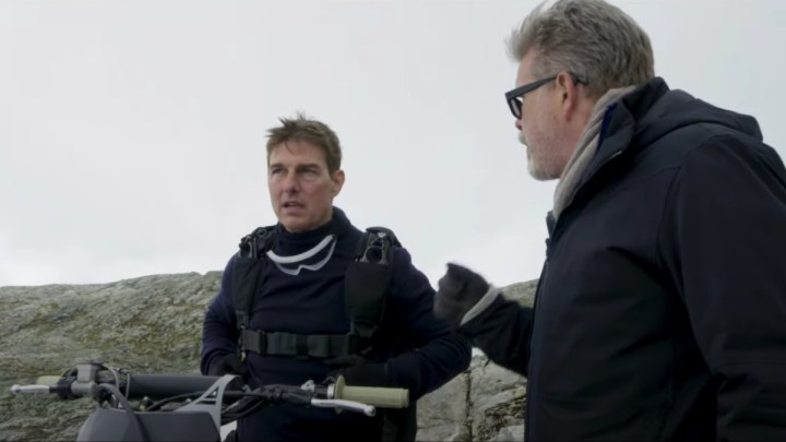 Tom Cruise talks with Christopher McQuarrie on the set of Mission: Impossible - Dead Reckoning Part 1."