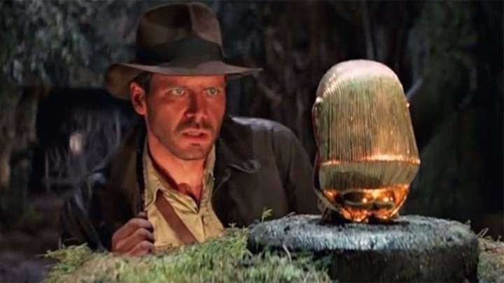 Indiana Jones staring at a golden idol in "Raiders of the Lost Ark."