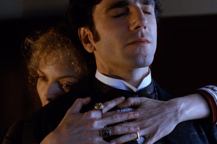 Michelle Pfeiffer hugs Daniel Day-Lewis in The Age of Innocence.