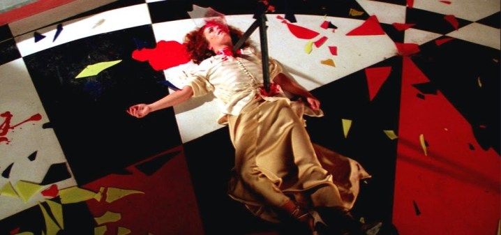 A woman lies dead on the ground in "Suspiria" (1977).