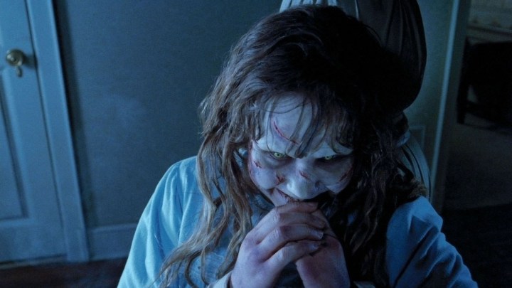 A possessed Regan smiles in 1973's "The Exorcist."