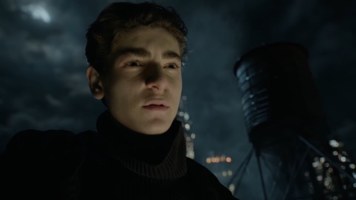 Bruce standing on a rooftop in "Gotham."