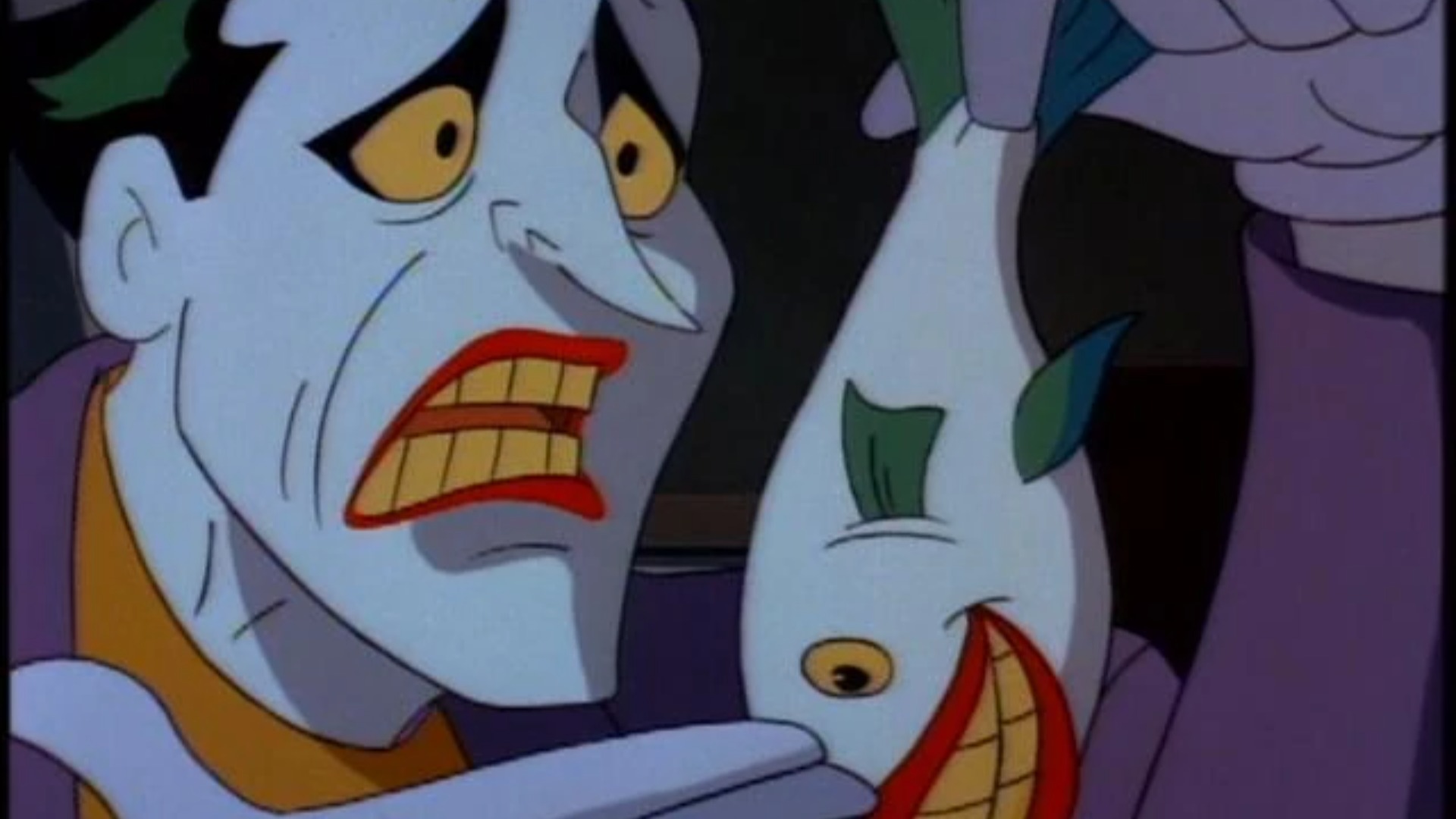 Joker holding one of his titular laughing fish in BTAS.