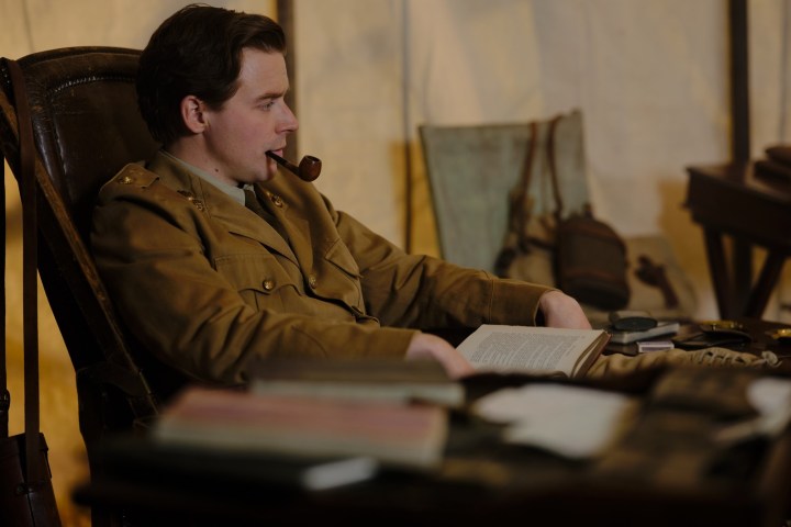 Sigfried Sassoon sits with a pipe in Benediction.