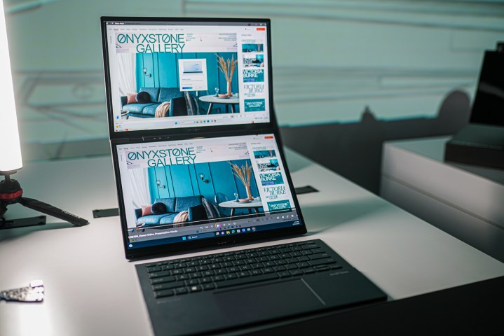 The two screens of the Zenbook Duo on a white table.