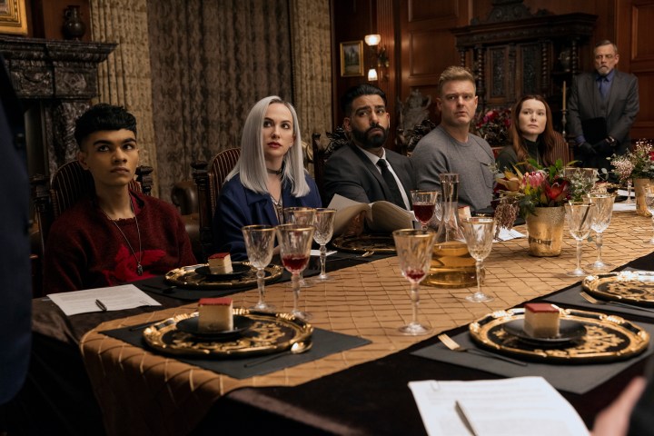 The Usher children sit at a dinner table together in The Fall of the House of Usher.