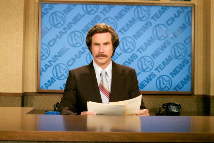 Ron Burgundy sitting at a news desk in "Anchorman: The Legend of Ron Burgundy."