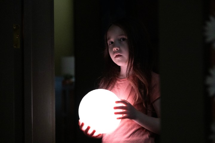 Vivien Lyra Blair holds a moon light in The Boogeyman.