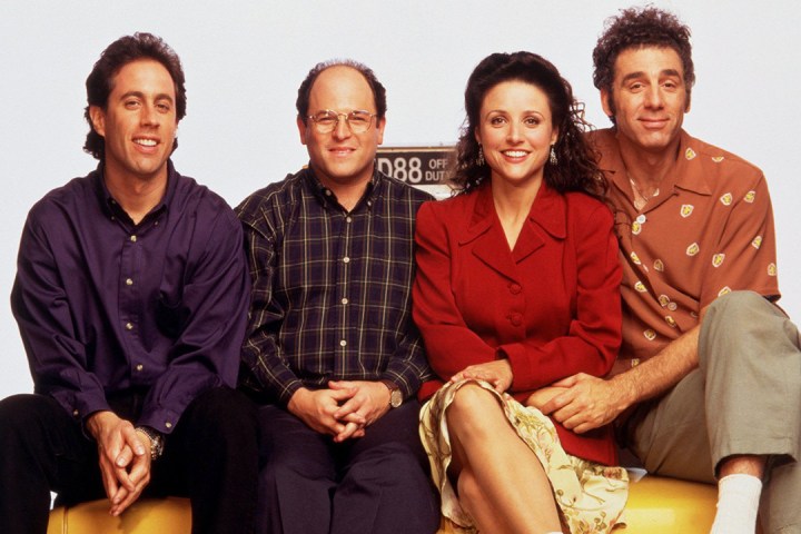 The cast of "Seinfeld" seated on a couch.