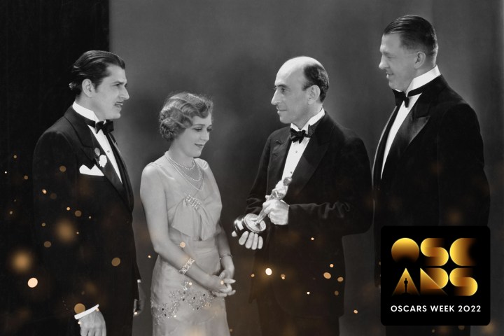 An Oscars Week badge is featured on an image of Hanns Kraly, President of the Academy of Motion Picture Arts and Sciences William C. DeMille, Mary Rickford, and actor Warner Baxter (1889-1951) attending the Oscars in Hollywood, California, USA, 4 April 1930.