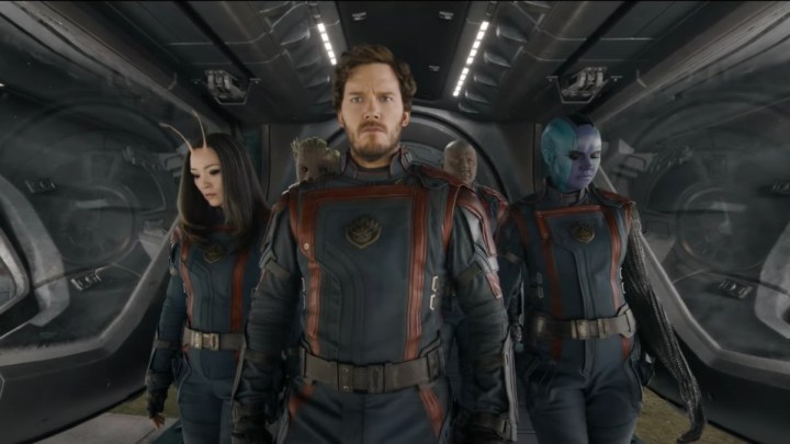 A group of superheroes walk down the steps of a ship in a scene from Guardians of the Galaxy Vol. 3.