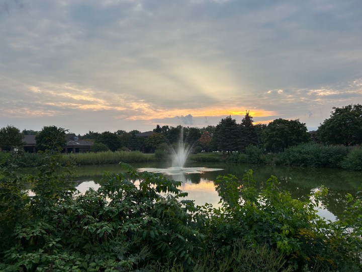 An outdoor photo of the sky and a pond, taken with the iPhone 14.