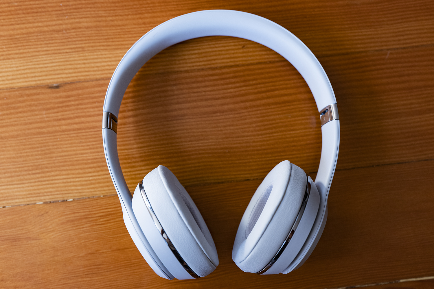 The Beats Solo3 wireless headphones on top of a table.