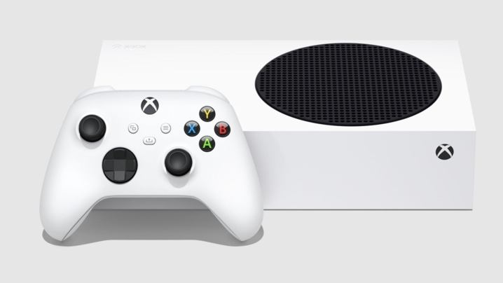 The Xbox Series S console on its side with controller.