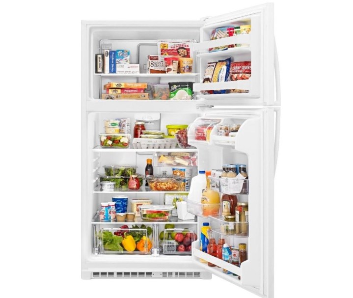 A refrigerator with a top freezer, both filled with food.