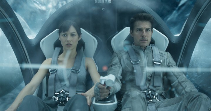 A man and a woman fly in a space ship in Oblivion.